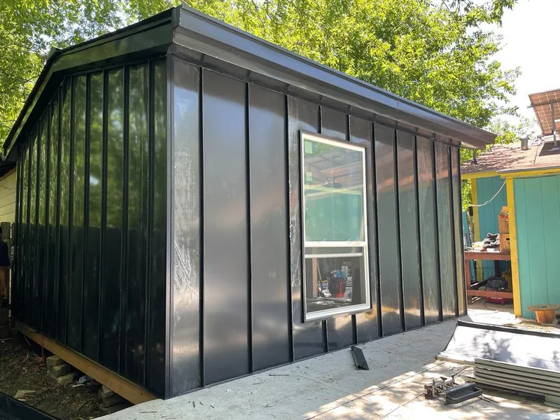 Black standing seam metal wall panels for Roof Inspection in Dennis